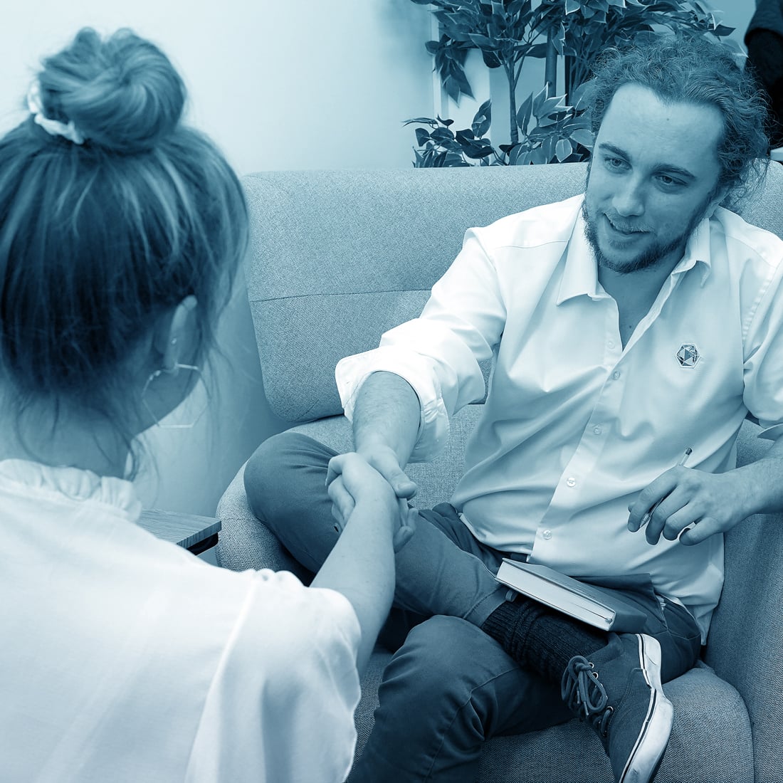 All About Games Director and Head of Marketing & Events, Philip Hatch, shaking hands with a client.